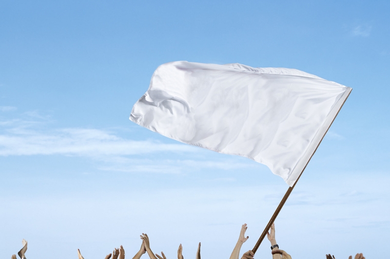 Spectators Waving a White Flag at a Sporting Event